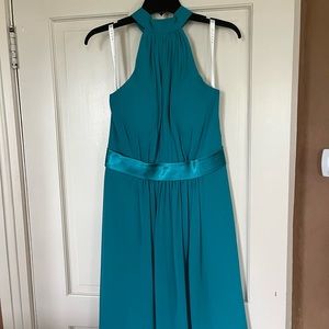 turquoise bridesmaid dress with open back.